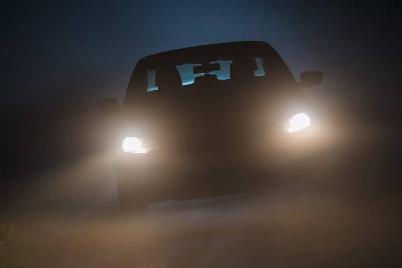 Car parked on a dark Saskatchewan road at night